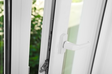 Photo of Modern window indoors, closeup view. Home interior