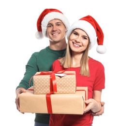 Photo of Young couple with Christmas gifts on white background