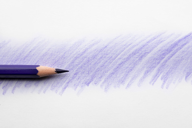 Photo of Purple pencil on sheet of paper with drawing, top view