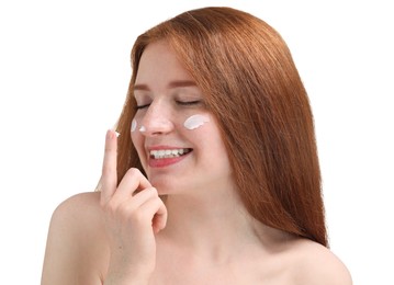 Photo of Smiling woman with freckles and cream on her face against white background, closeup