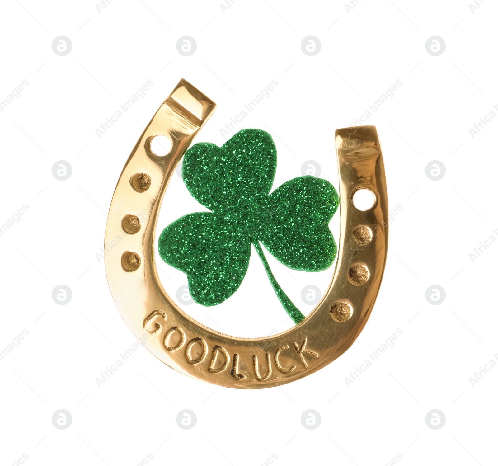 Photo of Golden horseshoe with phrase GOOD LUCK and clover on white background. St. Patrick's Day celebration