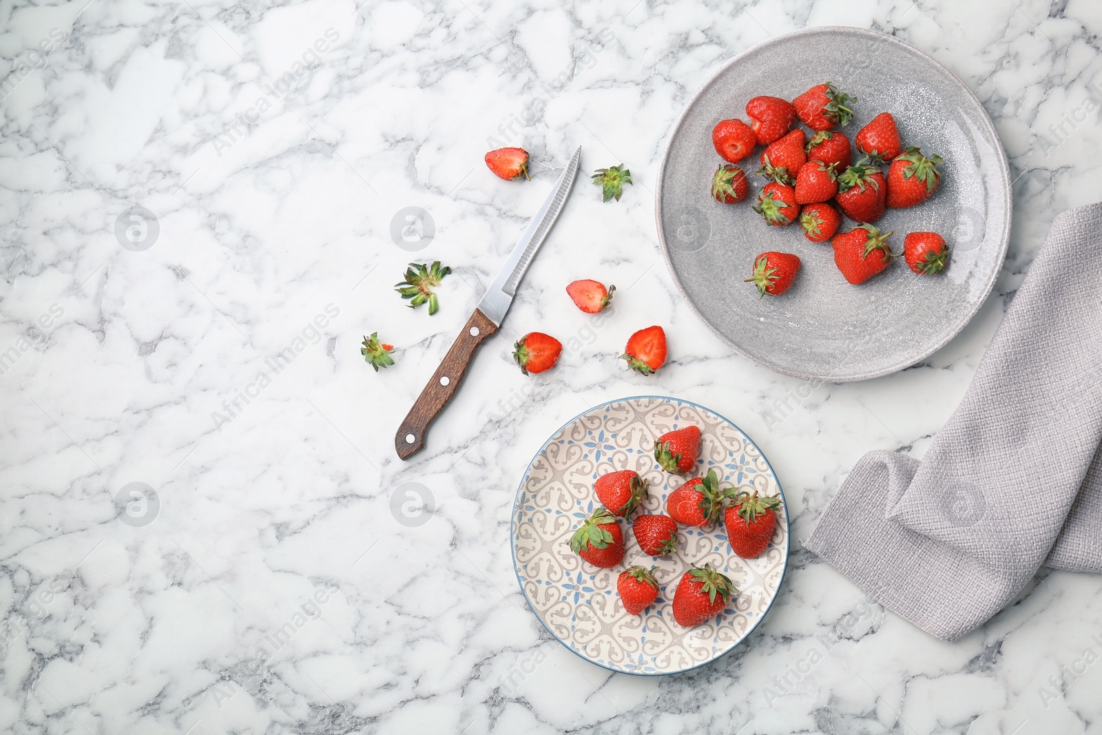 Photo of Flat lay composition with ripe red strawberries on marble background