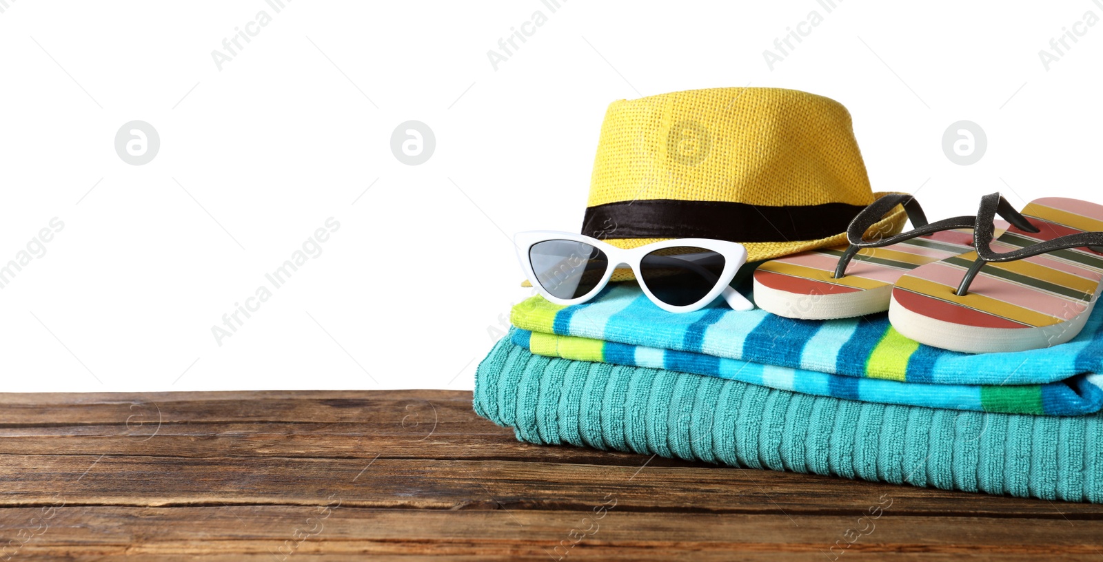 Photo of Composition with different beach objects on wooden table, white background