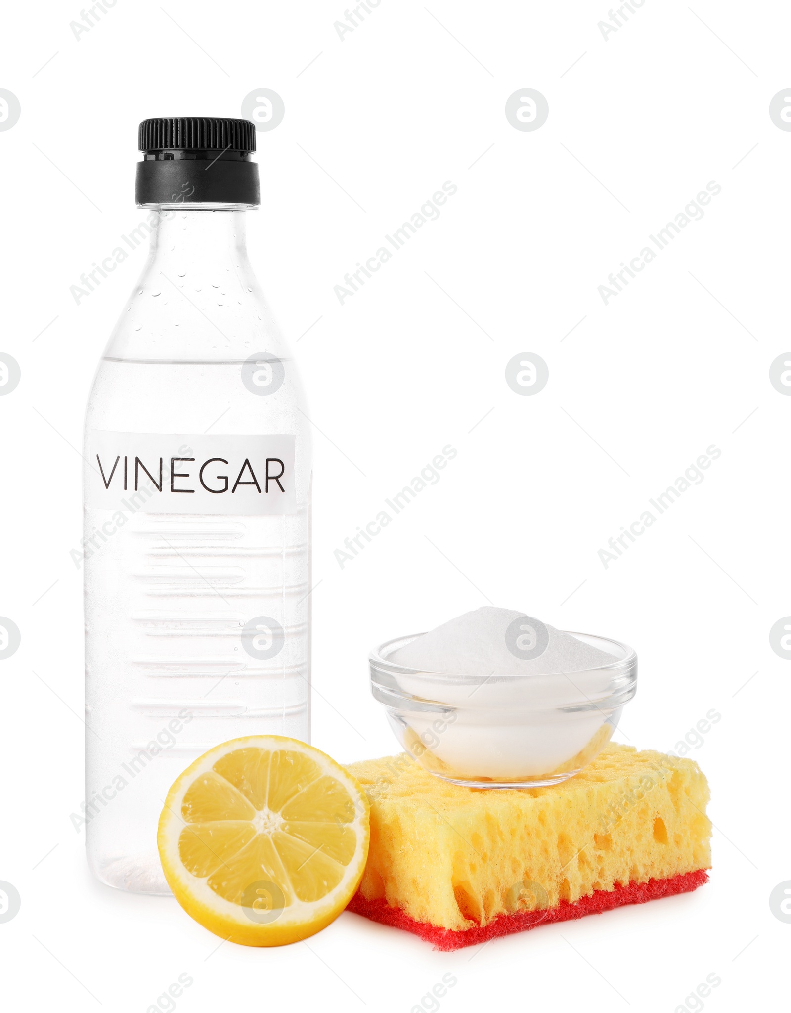 Photo of Eco friendly natural cleaners. Vinegar in bottle, cut lemon, sponge and bowl of soda isolated on white