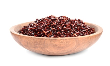 Bowl with delicious cooked brown rice on white background