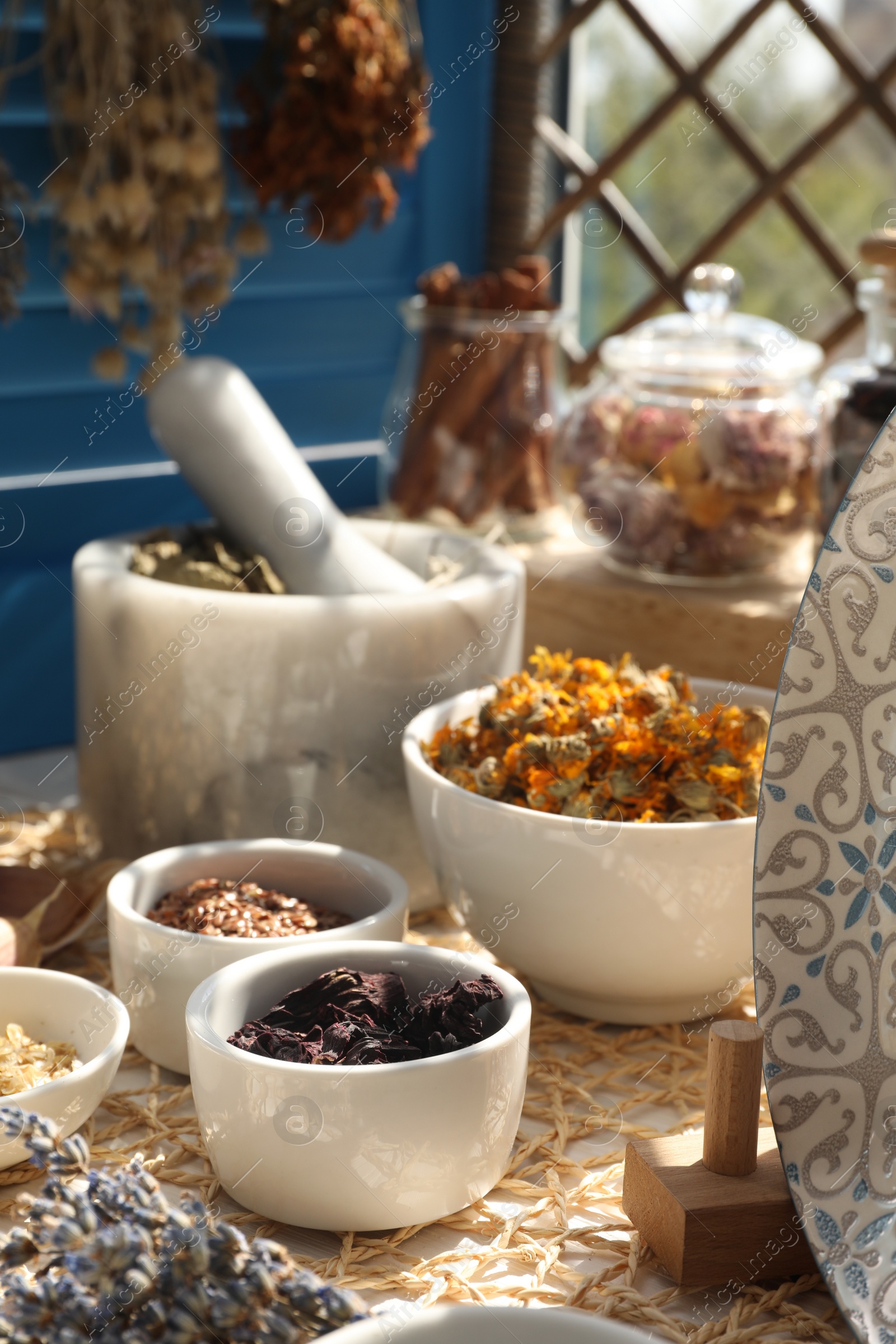 Photo of Many different dry herbs and flowers on table