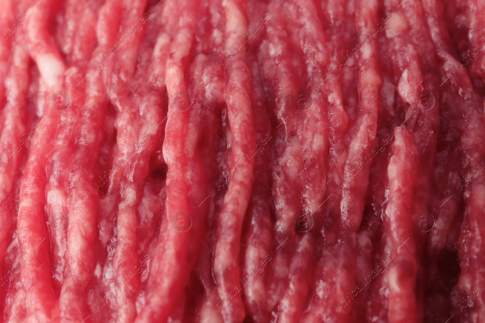 Photo of Fresh raw minced meat as background, closeup