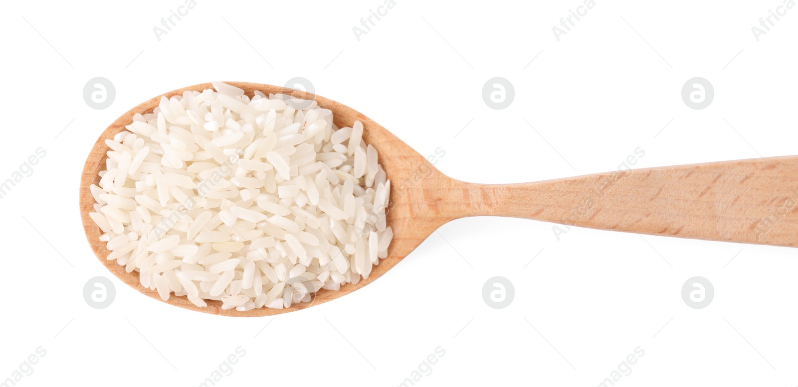 Photo of Uncooked rice in wooden spoon isolated on white, top view