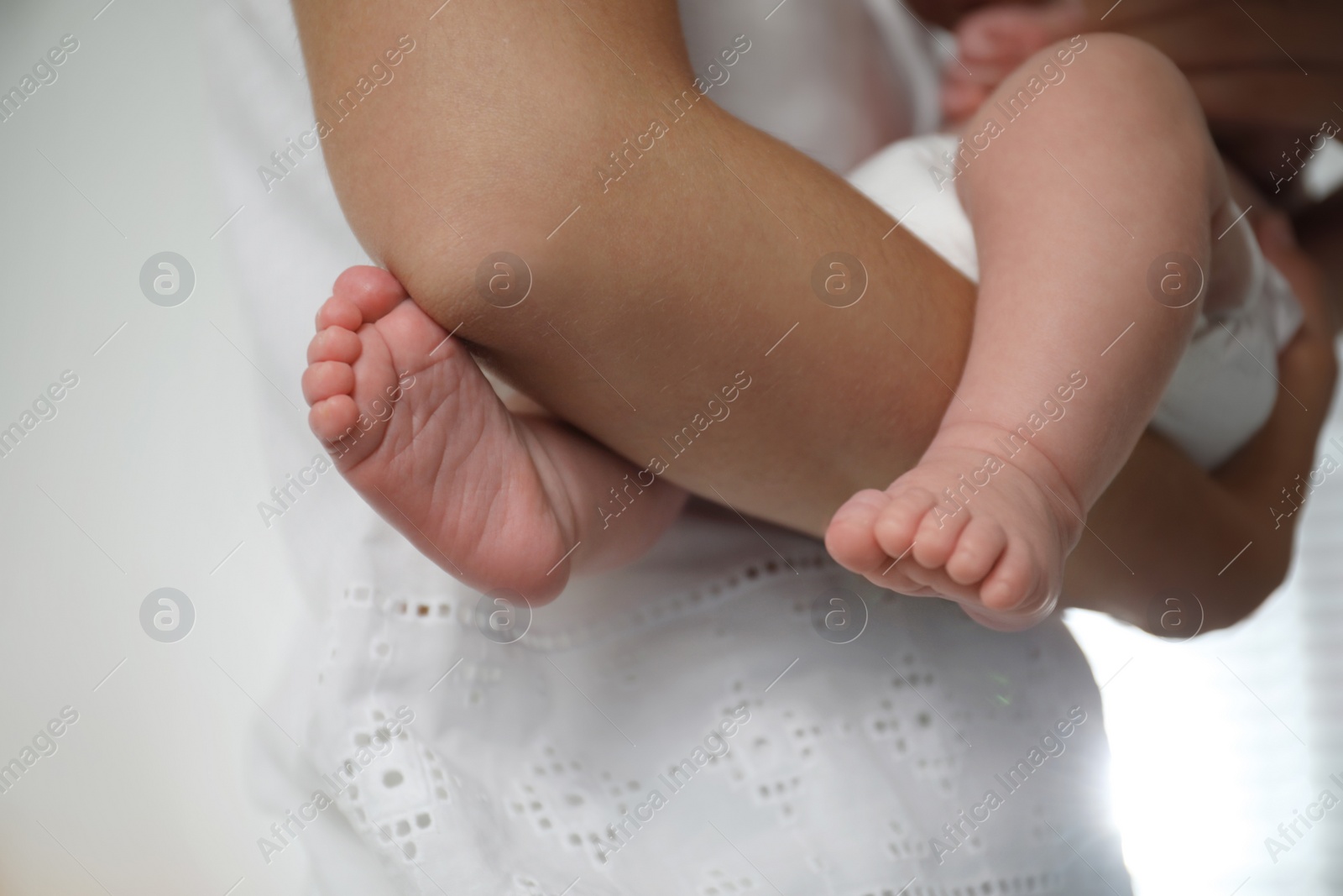 Photo of Mother with her newborn baby, closeup view