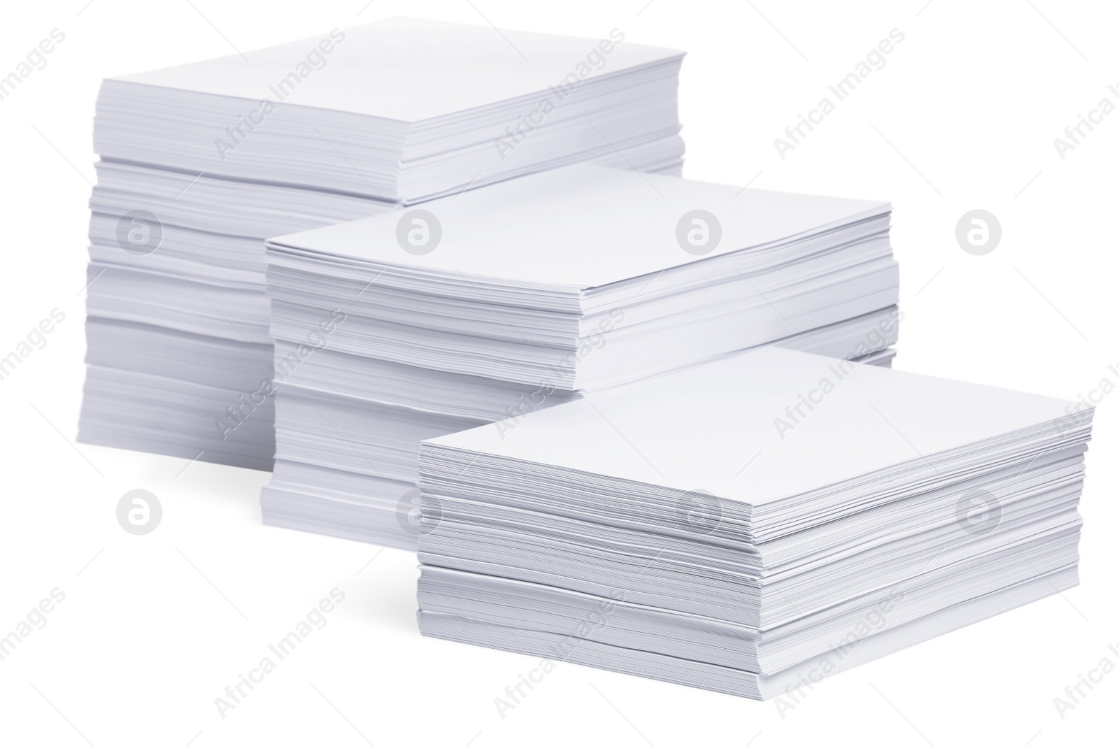 Photo of Stacks of paper sheets on white background