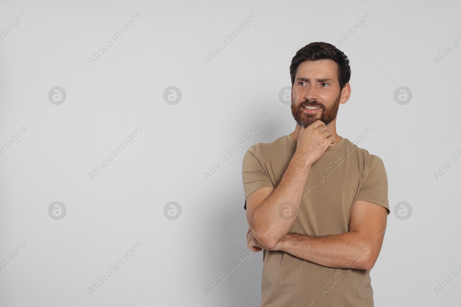 Photo of Portrait of handsome bearded man on white background