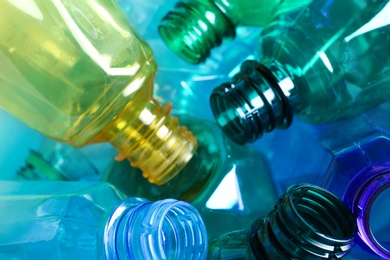 Photo of Used plastic bottles as background, closeup. Recycling problem