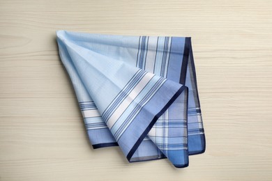 Photo of Stylish handkerchief on white wooden table, top view