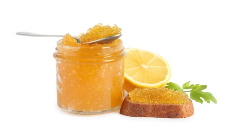 Photo of Fresh pike caviar in jar, bread and lemon isolated on white