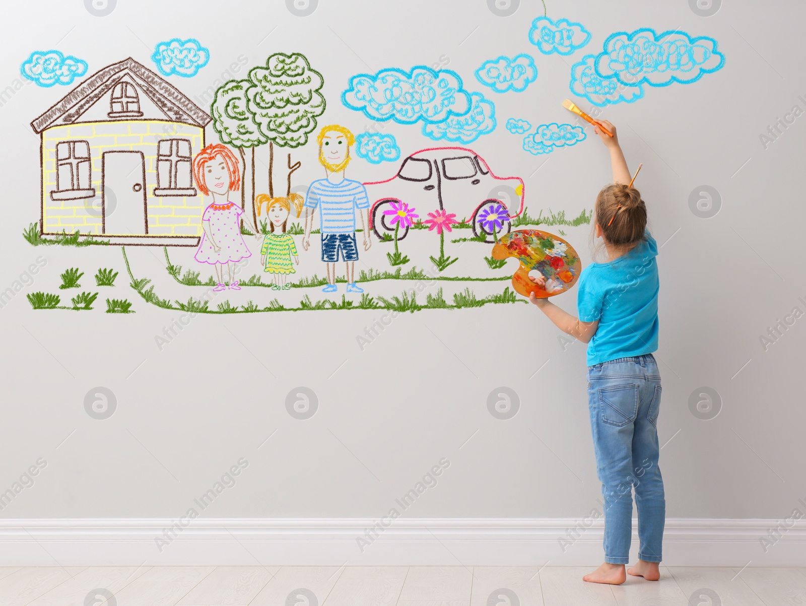Image of Cute child girl painting on light grey wall indoors