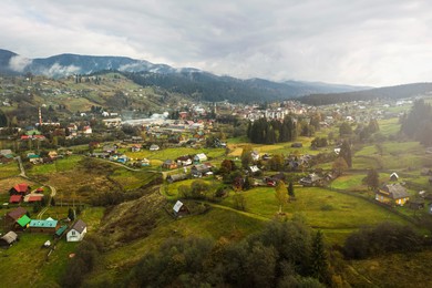Image of Aerial view of mountain village on autumn day