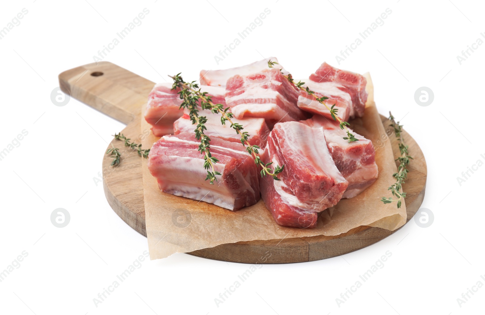 Photo of Cut raw pork ribs with thyme isolated on white