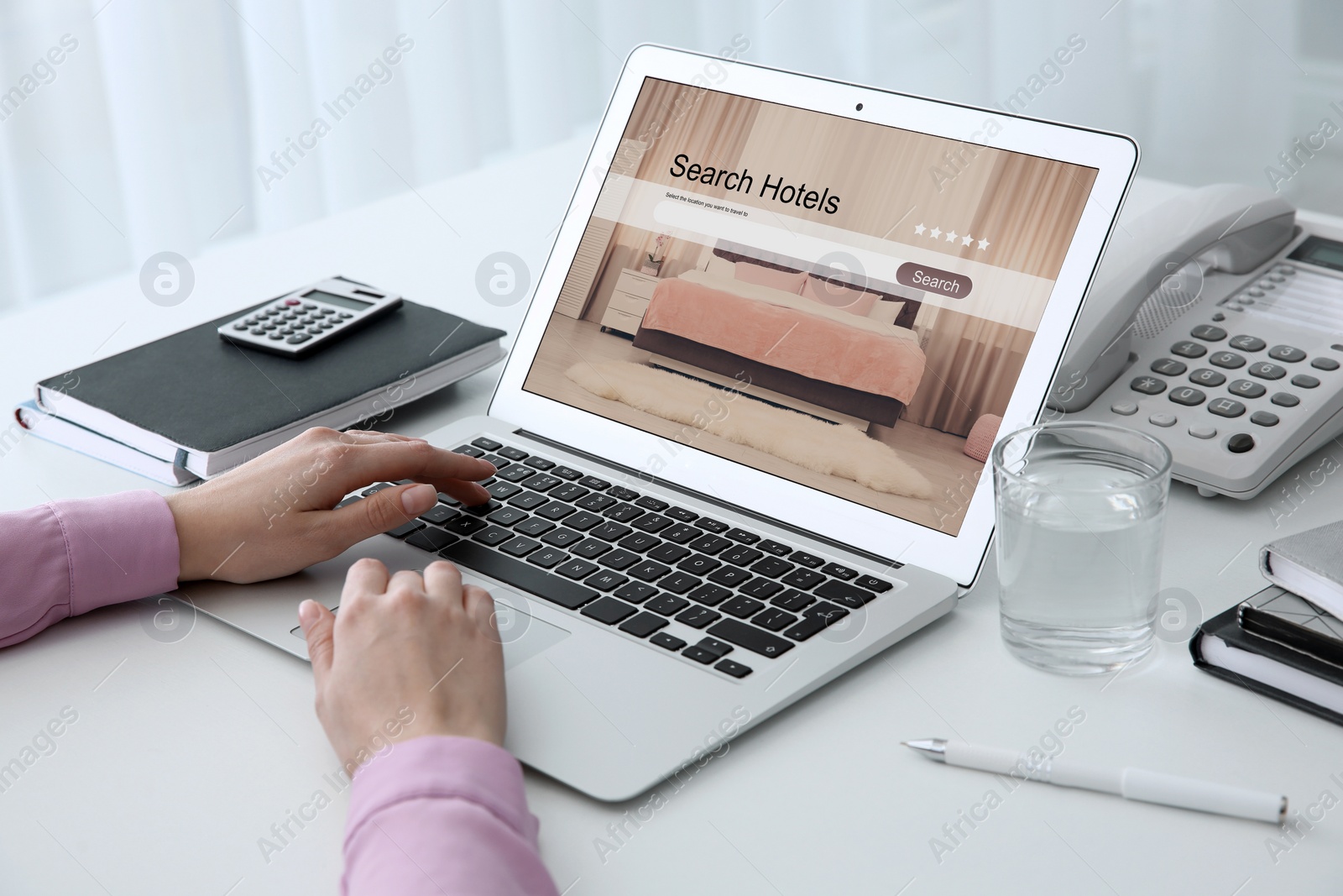 Image of Woman searching hotel using laptop at table, closeup. Booking online service