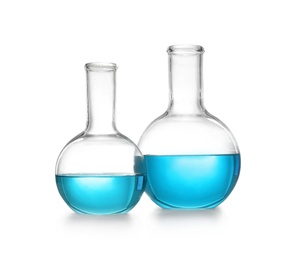 Photo of Laboratory glassware with liquid on white background. Solution chemistry