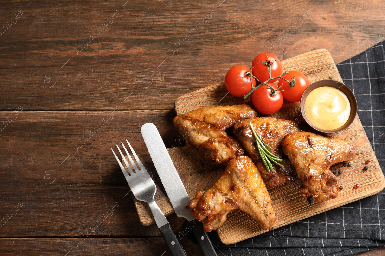 Photo of Flat lay composition with delicious barbecued chicken on wooden background. Space for text