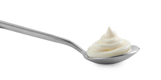 Photo of Silver spoon with mayonnaise isolated on white