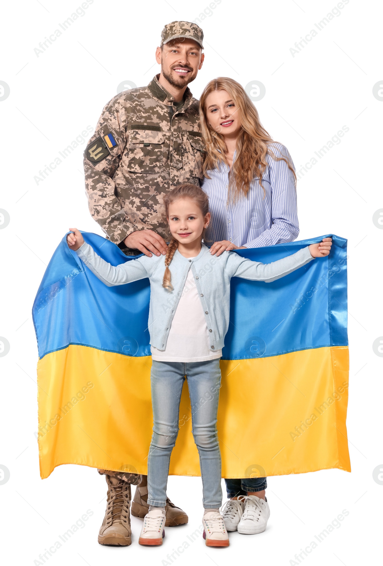 Photo of Soldier in military uniform reunited with his family and Ukrainian flag on white background