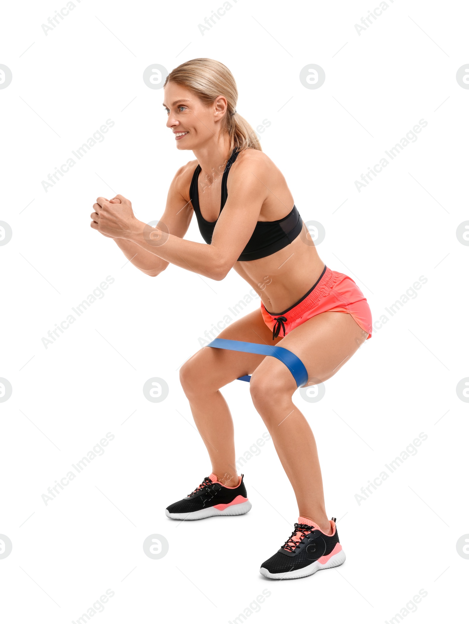 Photo of Woman exercising with elastic resistance band on white background