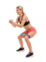 Photo of Woman exercising with elastic resistance band on white background