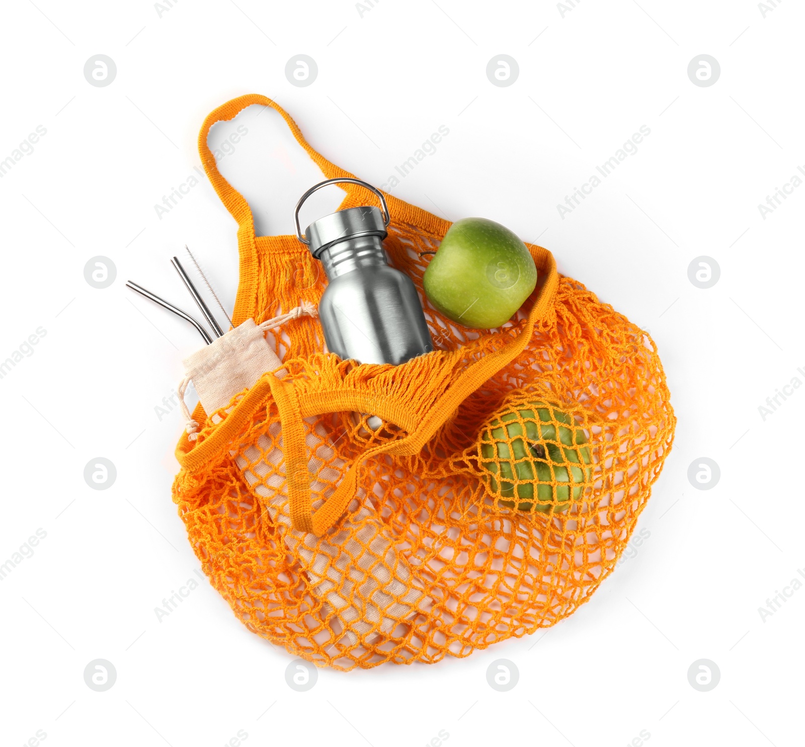 Photo of Mesh bag with different items isolated on white, top view. Conscious consumption