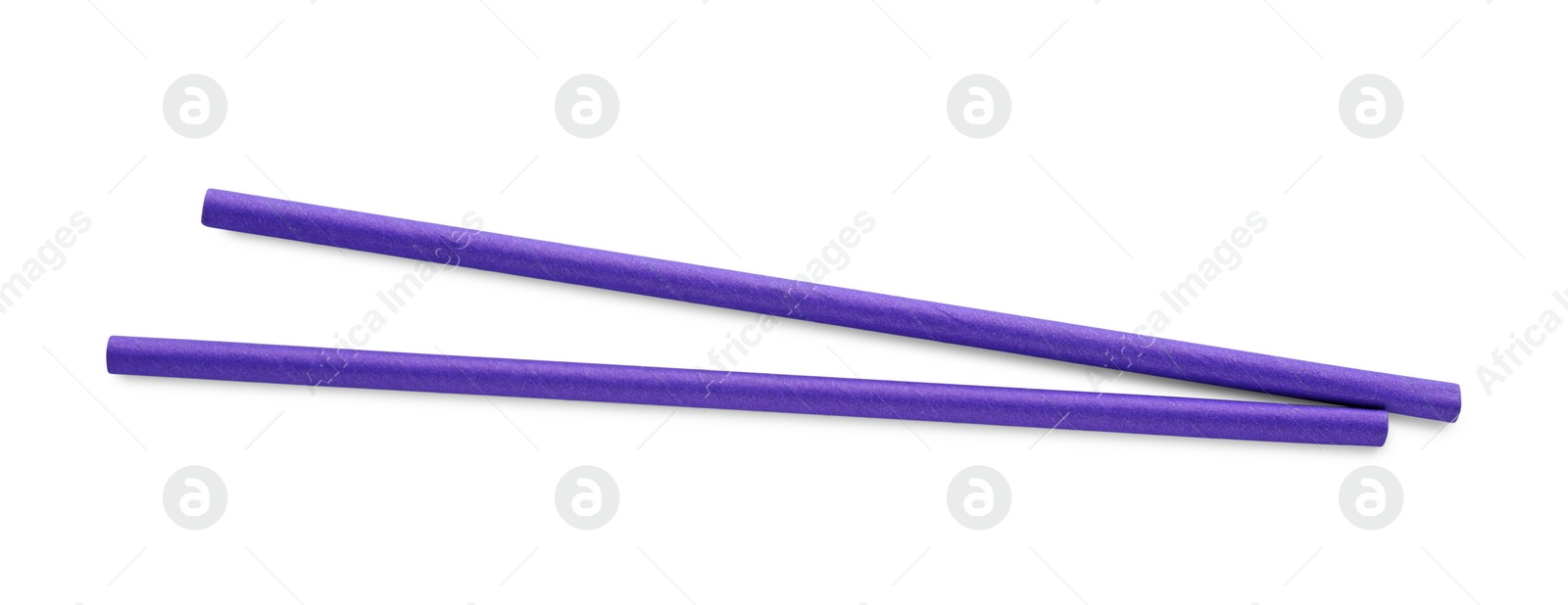 Photo of Purple paper cocktail straws on white background, top view