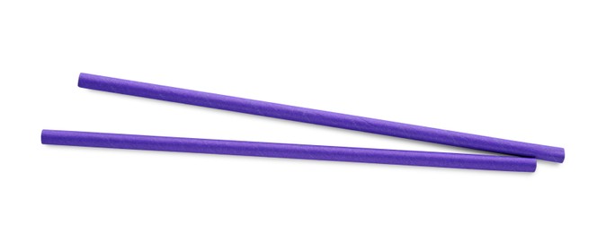 Photo of Purple paper cocktail straws on white background, top view