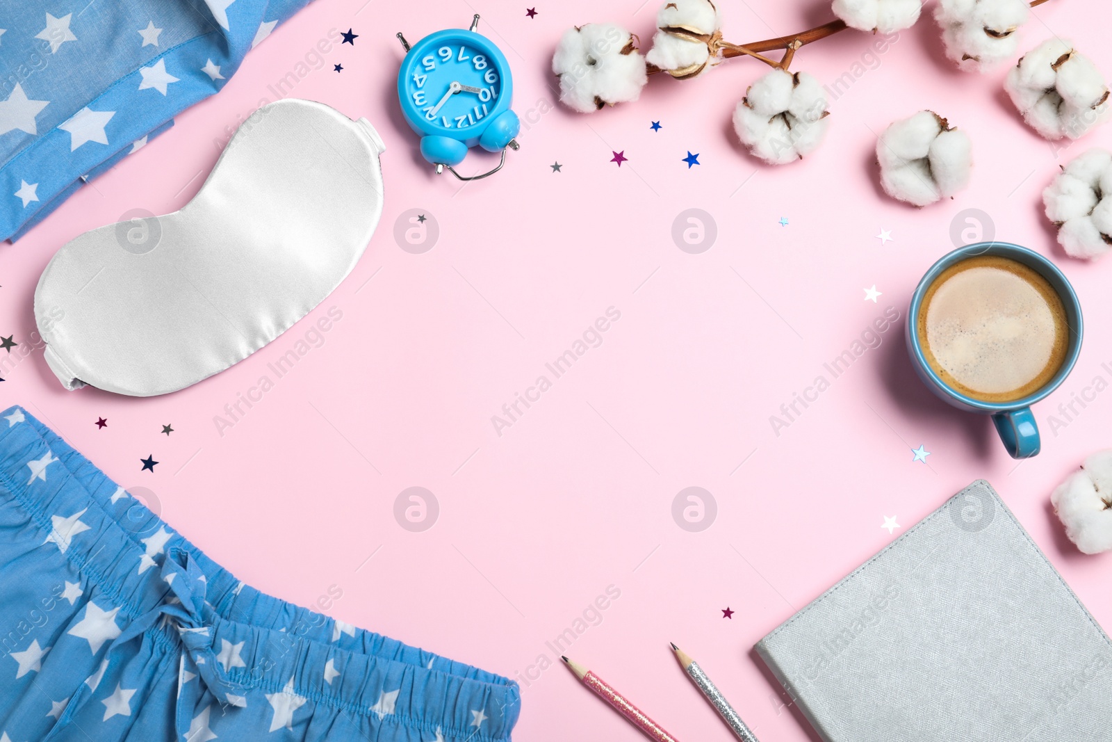 Photo of Flat lay composition with sleeping mask on pink background, space for text. Bedtime accessories