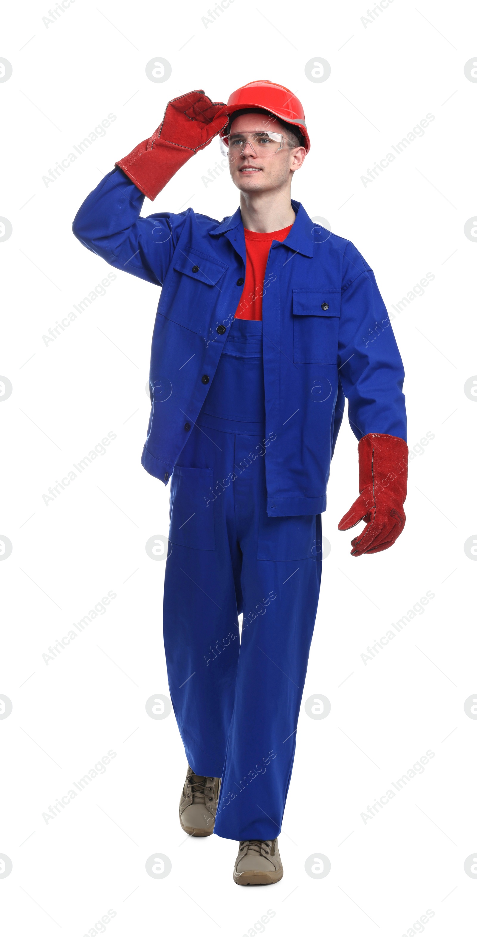 Photo of Young man wearing safety equipment on white background