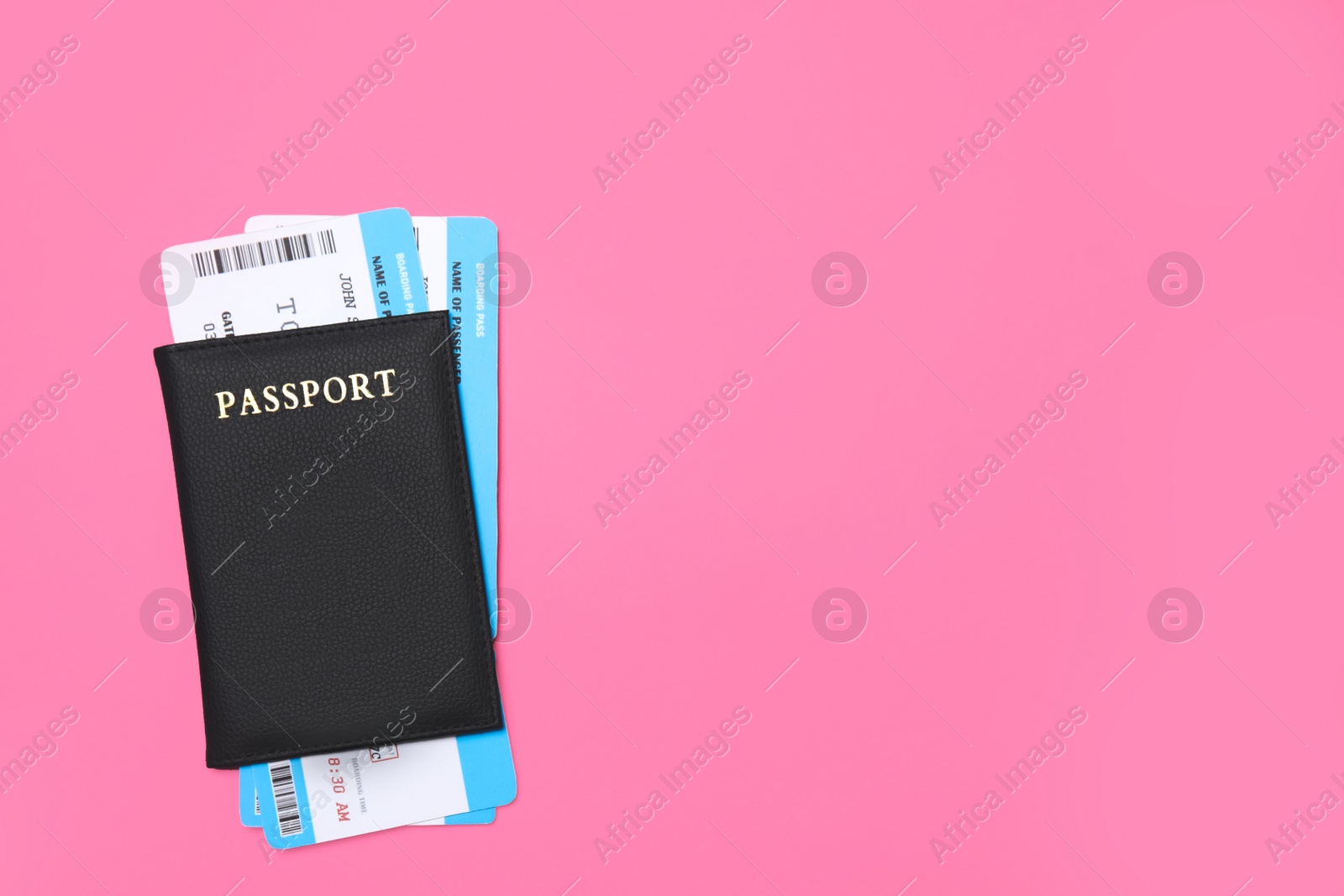 Photo of Passport with tickets on pink background, top view. Space for text