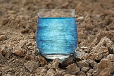 Save environment. Sea in glass on dry land, closeup