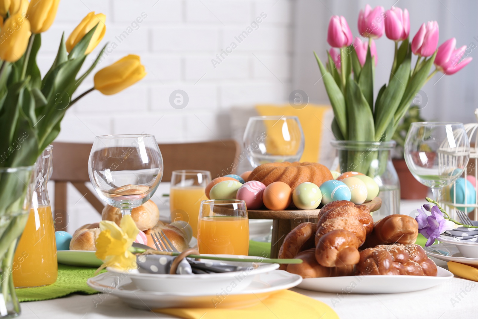 Photo of Festive Easter table setting with traditional meal at home