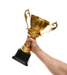 Young man holding gold trophy cup on white background, closeup