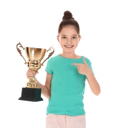 Photo of Happy girl with golden winning cup isolated on white