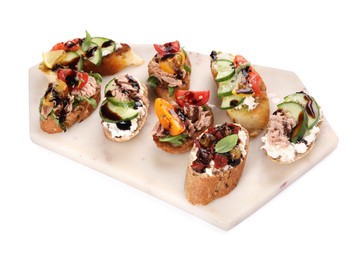 Delicious bruschettas with balsamic vinegar and different toppings isolated on white, above view