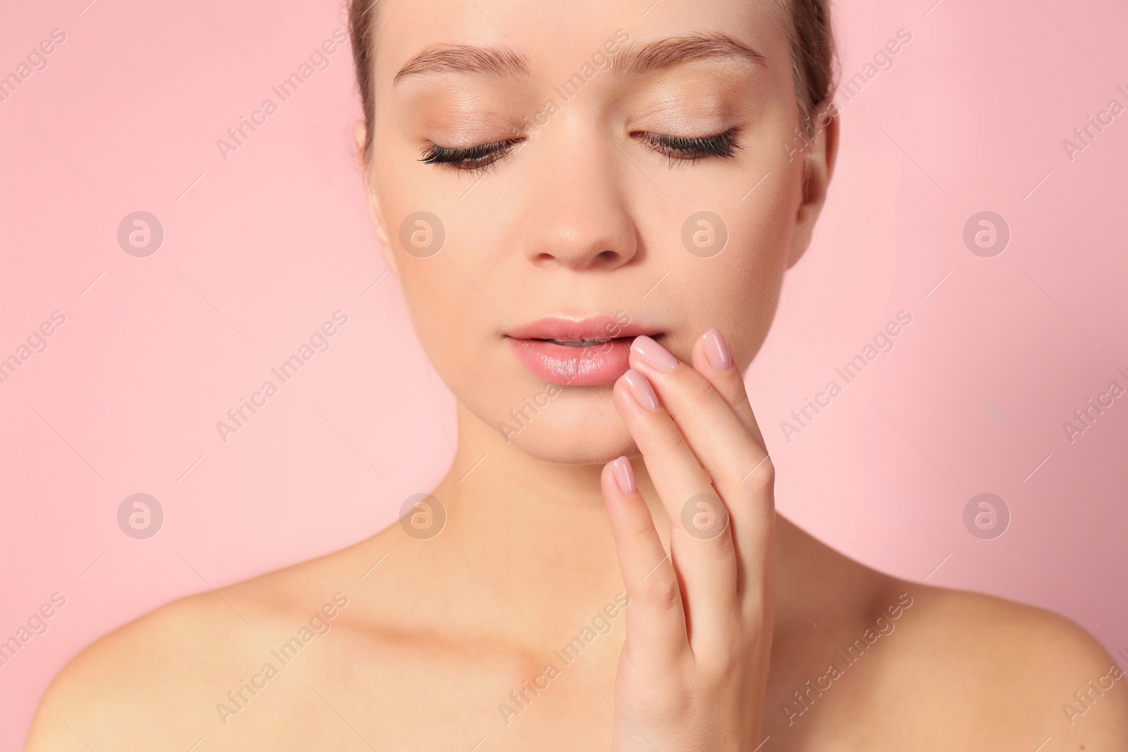 Photo of Portrait of beautiful young woman on color background. Lips contouring, skin care and cosmetic surgery concept