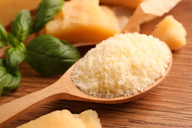 Photo of Delicious parmesan cheese on wooden table, closeup