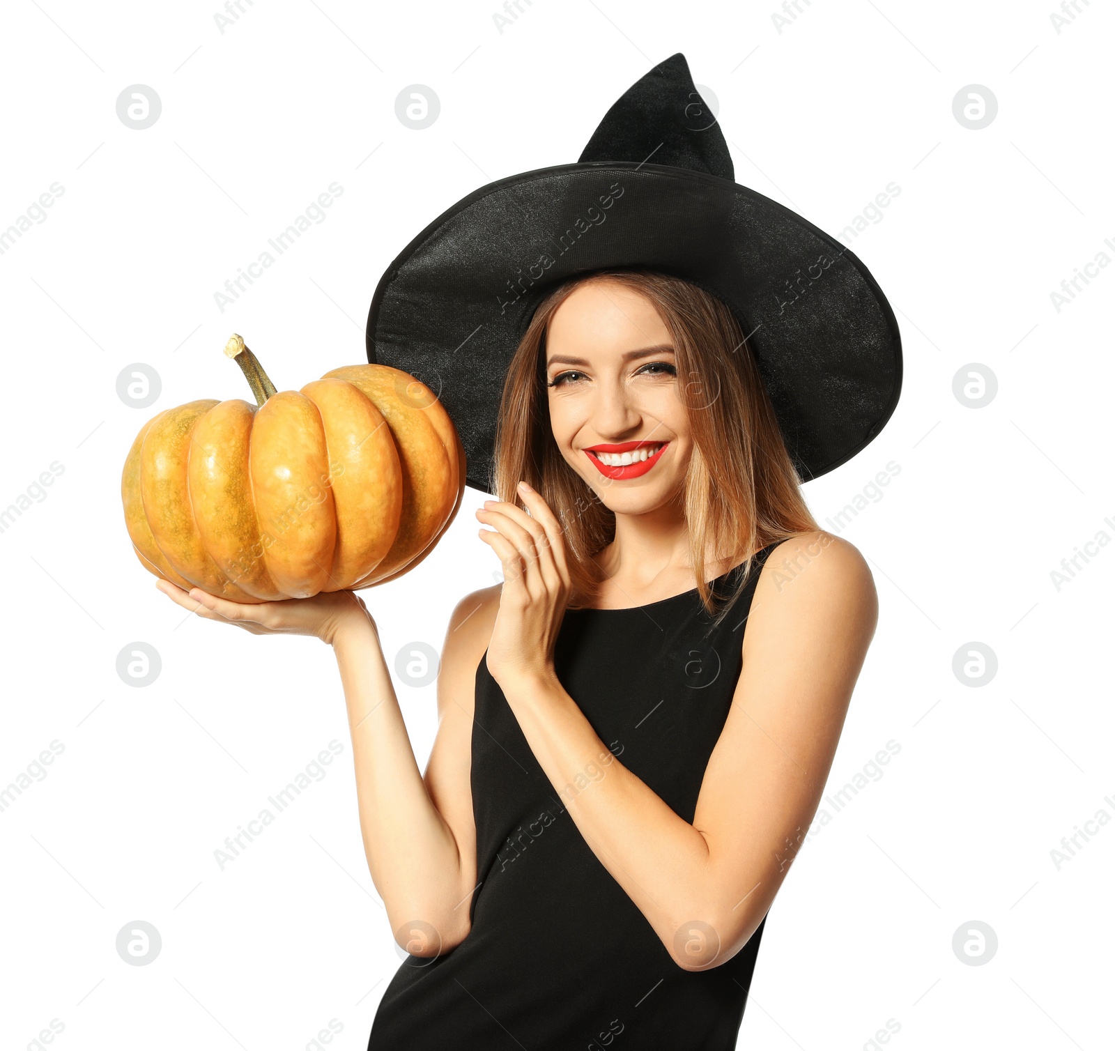 Photo of Beautiful woman wearing witch costume with pumpkin for Halloween party on white background