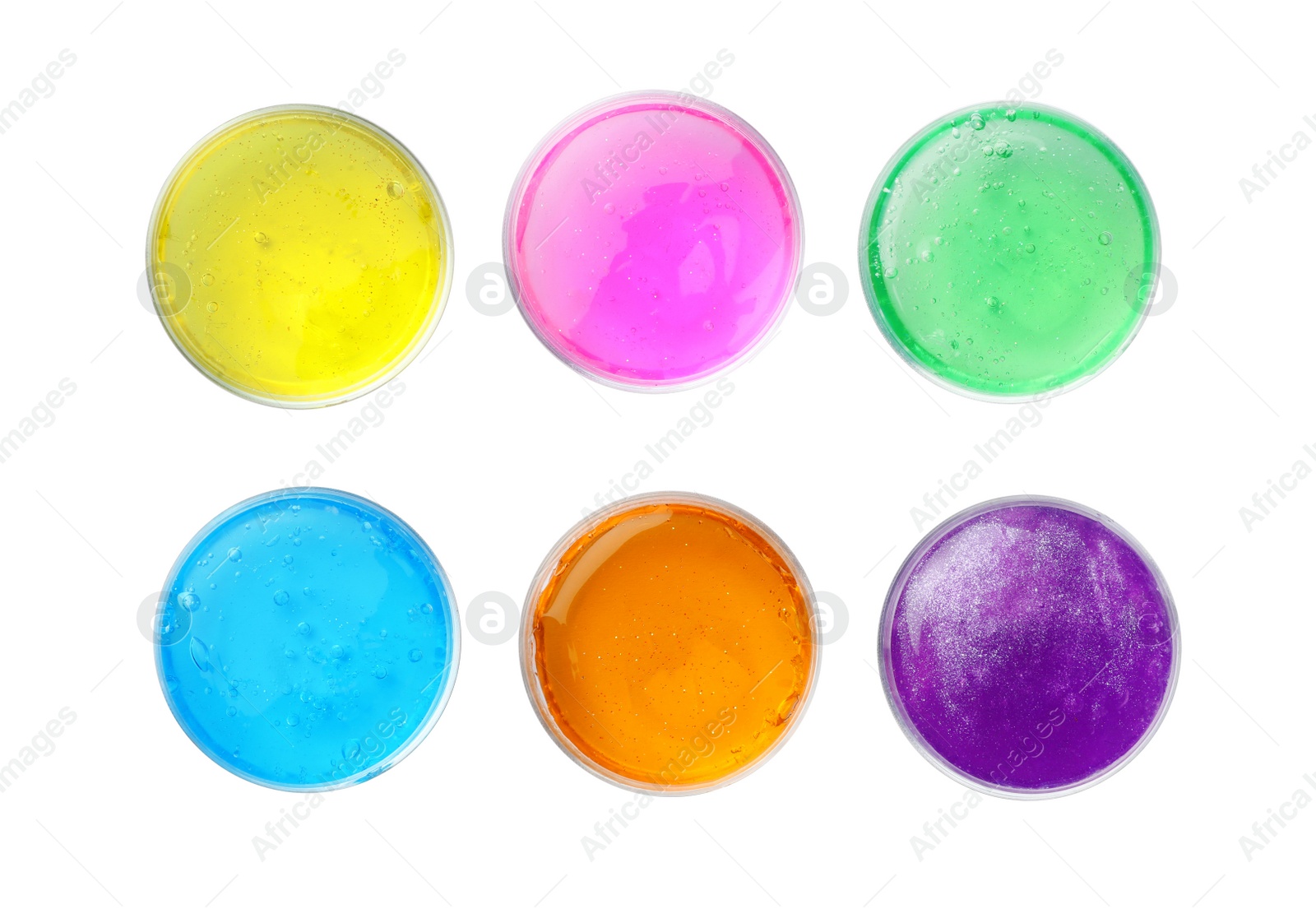 Photo of Colorful slimes in plastic containers on white background, top view. Antistress toy