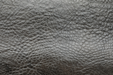 Photo of Texture of black leather as background, closeup