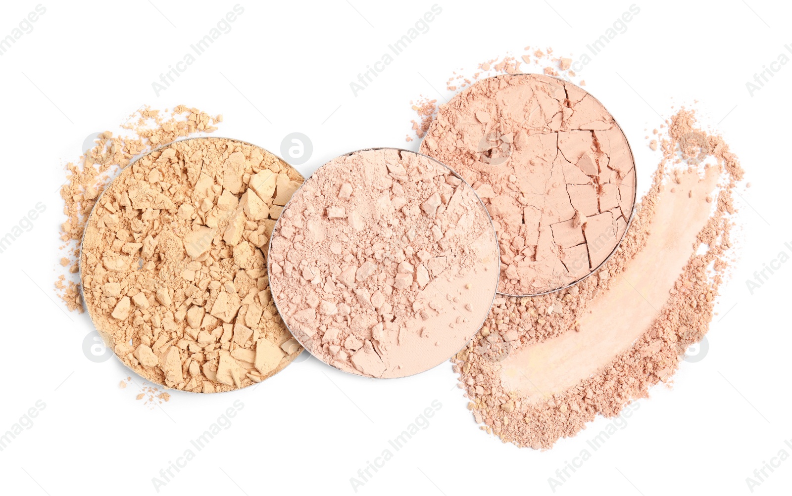 Photo of Different face powders and swatch on white background, top view