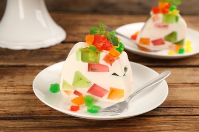 Delicious broken glass jelly dessert on wooden table