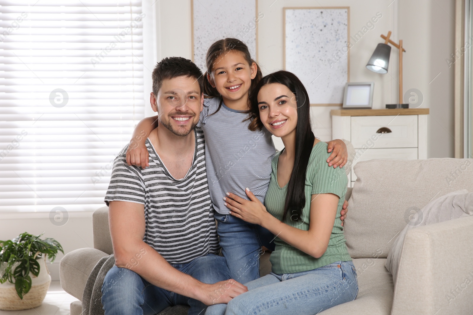 Photo of Portrait of happy family in living room. Adoption concept