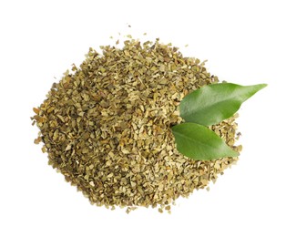 Photo of Pile of aromatic mate tea and fresh leaves on white background, top view