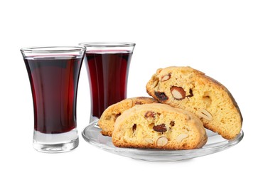 Photo of Tasty cantucci and glasses of liqueur on white background. Traditional Italian almond biscuits