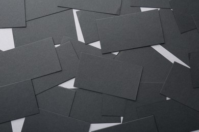 Blank black business cards on table, flat lay. Mockup for design